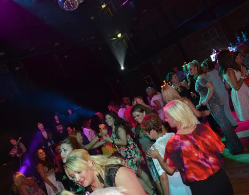 An event at the Main Space in the Black-E, with crowds dancing.